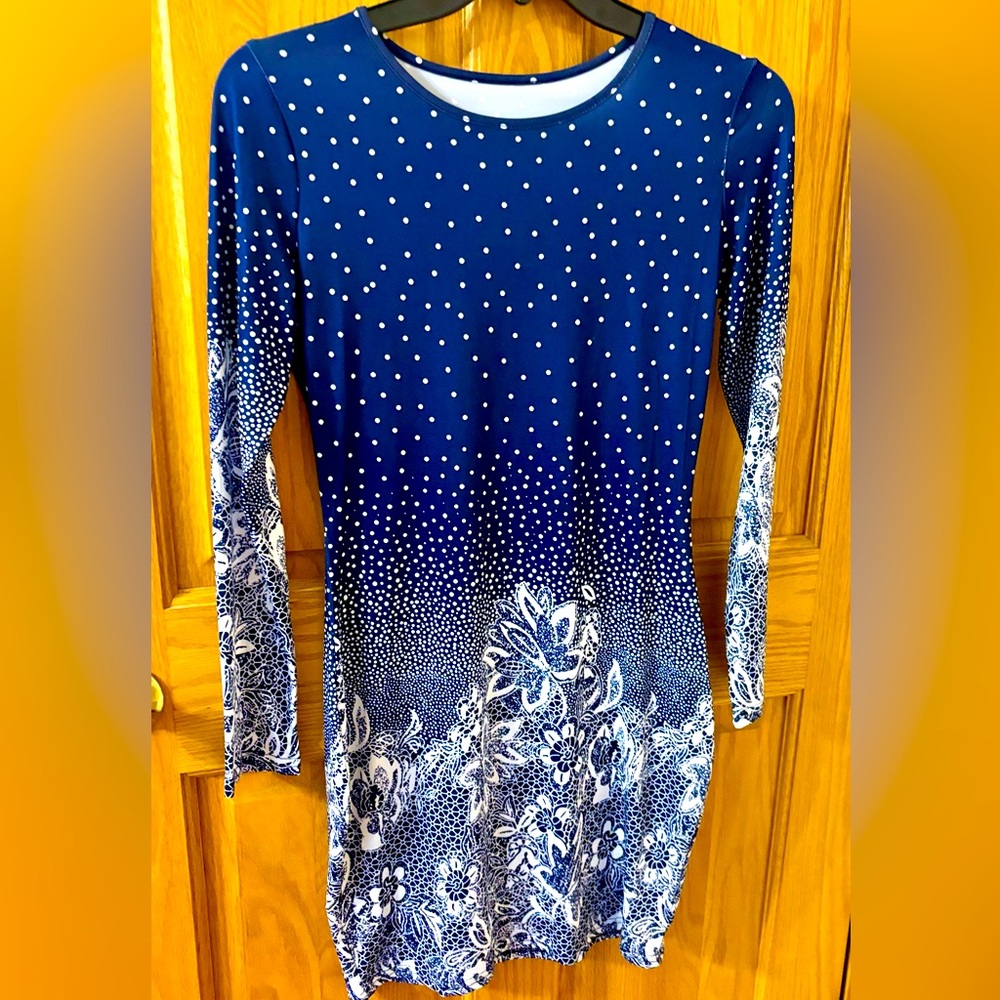New, never worn. Cool, comfortable, figure flattering dress. Large